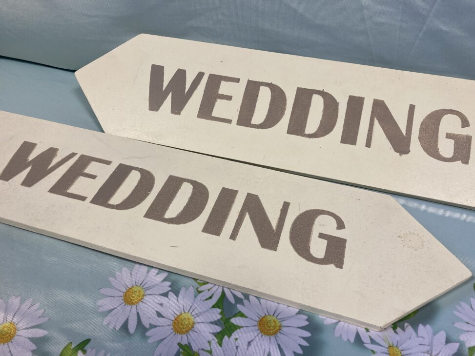 Pale blue wooden wedding signs hire