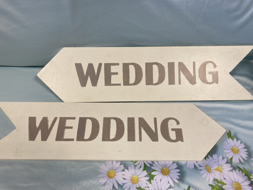 Pair of pale blue wedding signs for hire